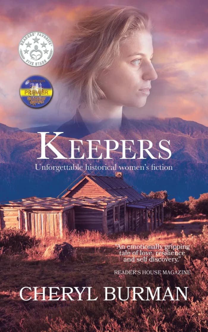 Floating head of a young woman above an outback Australian landscape of rugged mountains and a log cabin. Colours are shades of purple and browns. The title Keepers is in white