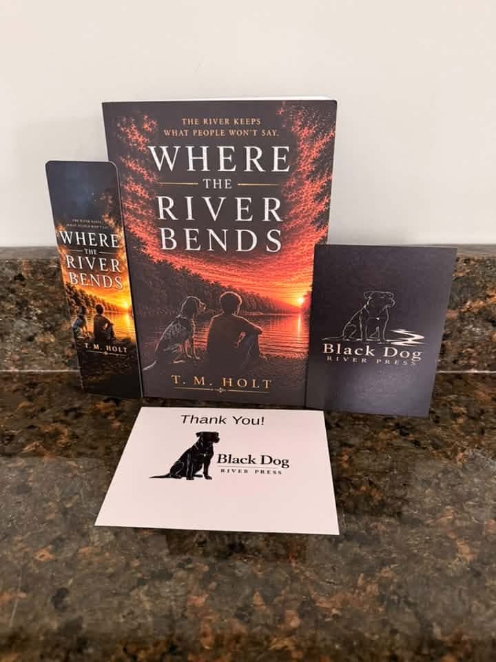 The cover of Where the River Bends by T. M. Holt captures the warmth and quiet beauty of rural Tennessee in the summer of 1978.
Bathed in rich shades of amber, gold, and burnt orange, a Tennessee river winds through a peaceful Southern landscape beneath a glowing sunset.